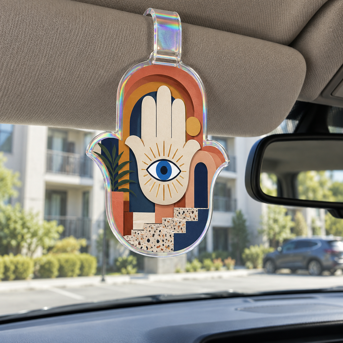 Hamsa Modern Gallery Holographic Car Visor Clip with printed optical 3D artwork in its use setting