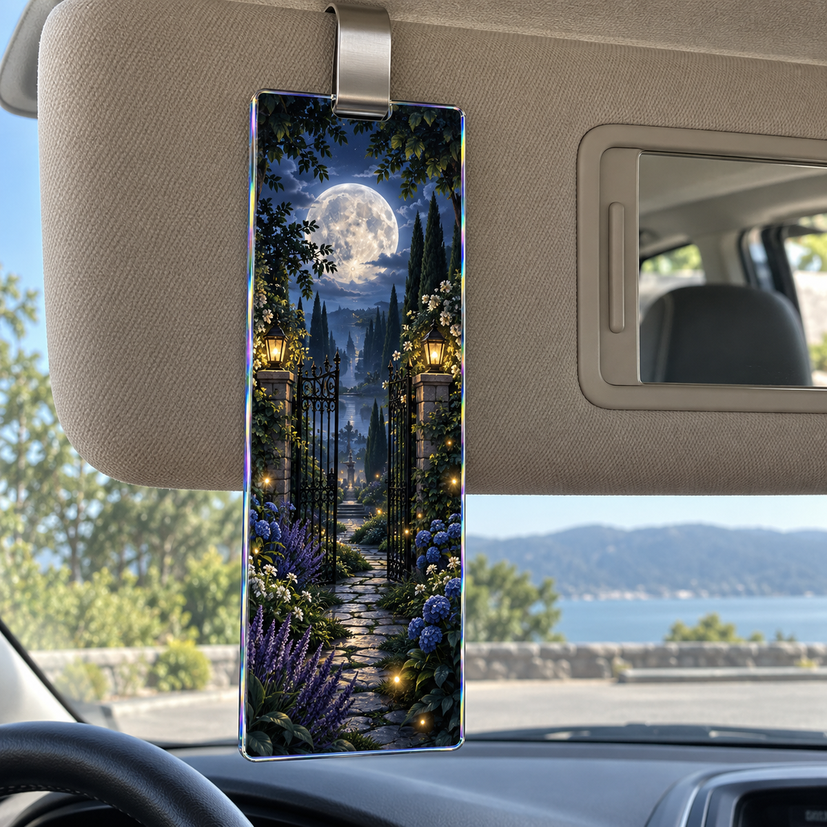 Moonlit Garden Gate Holographic Car Visor Clip with printed optical 3D artwork in its use setting