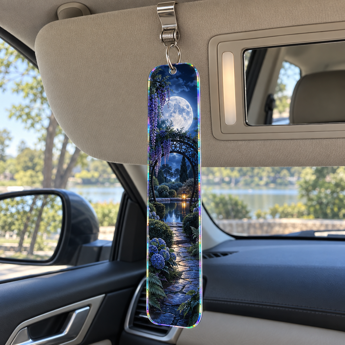 Moon Gate Retreat Holographic Car Visor Clip with printed optical 3D artwork in its use setting