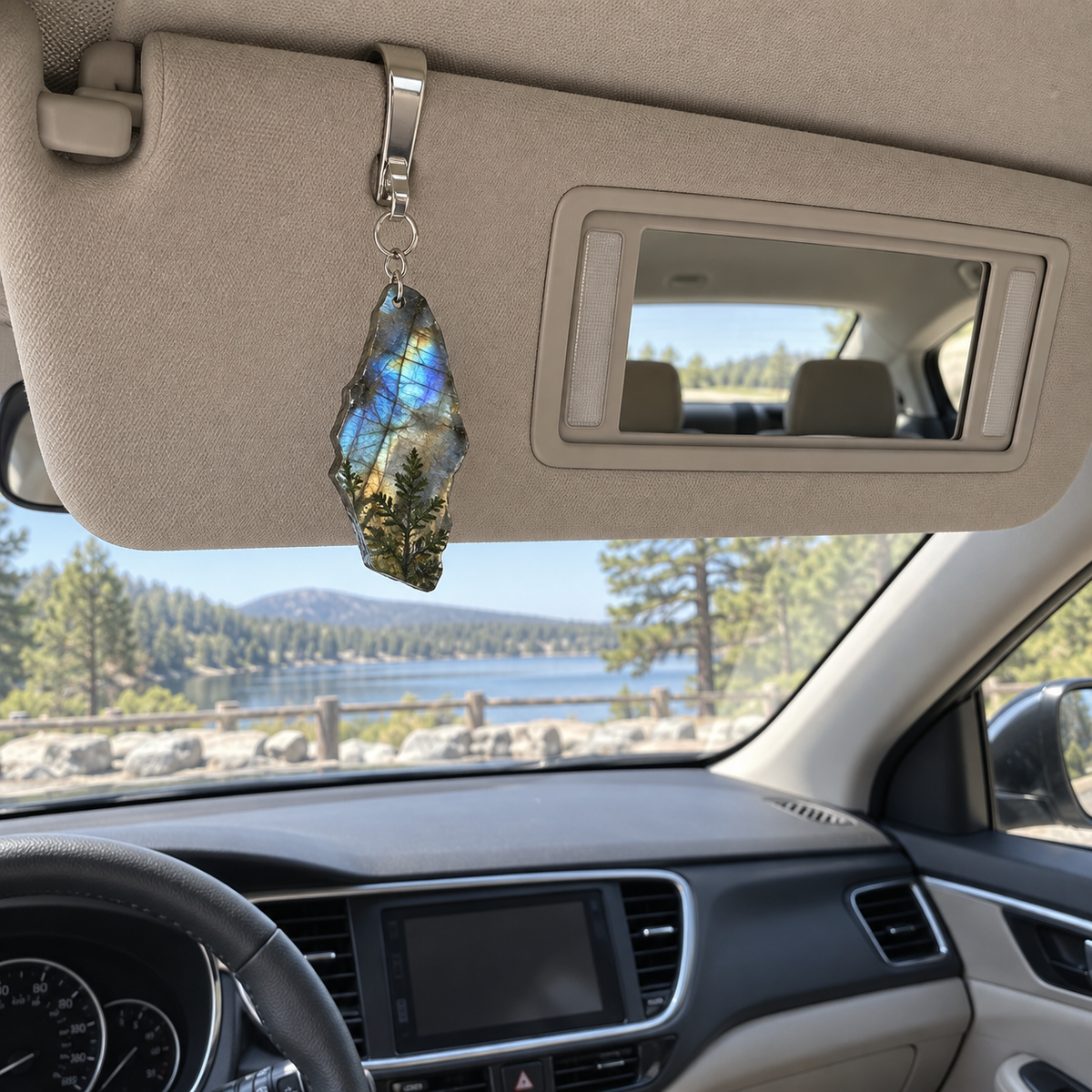 Moss Labradorite Treasure Holographic Car Visor Clip with printed optical 3D artwork in its use setting