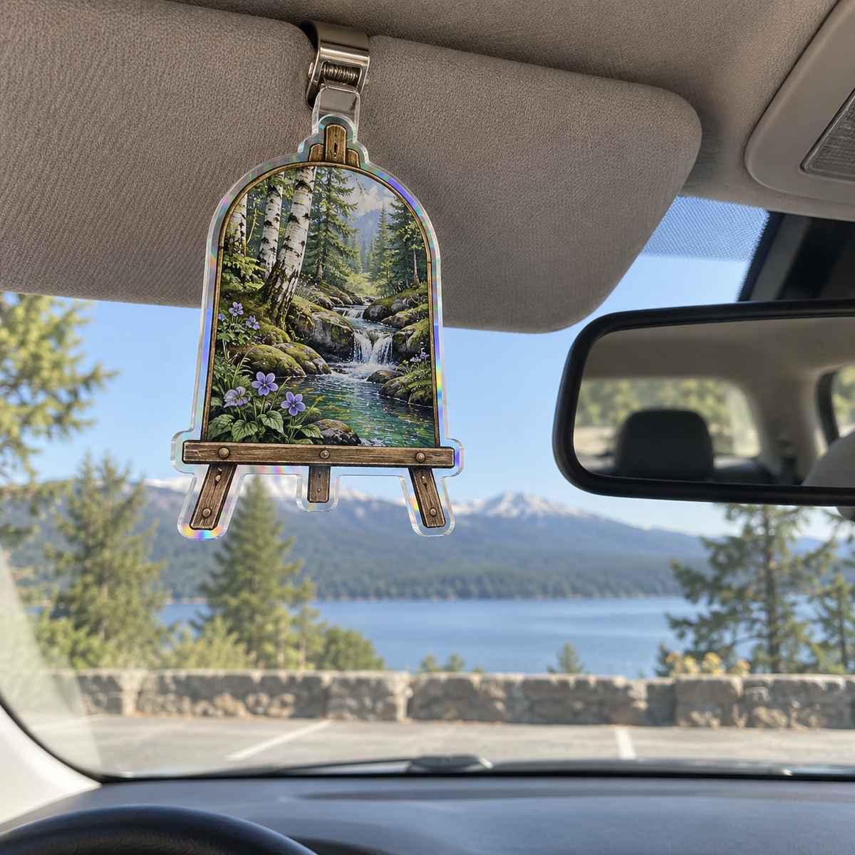 Silverthread Studio Brook Holographic Car Visor Clip with printed optical 3D artwork in its use setting