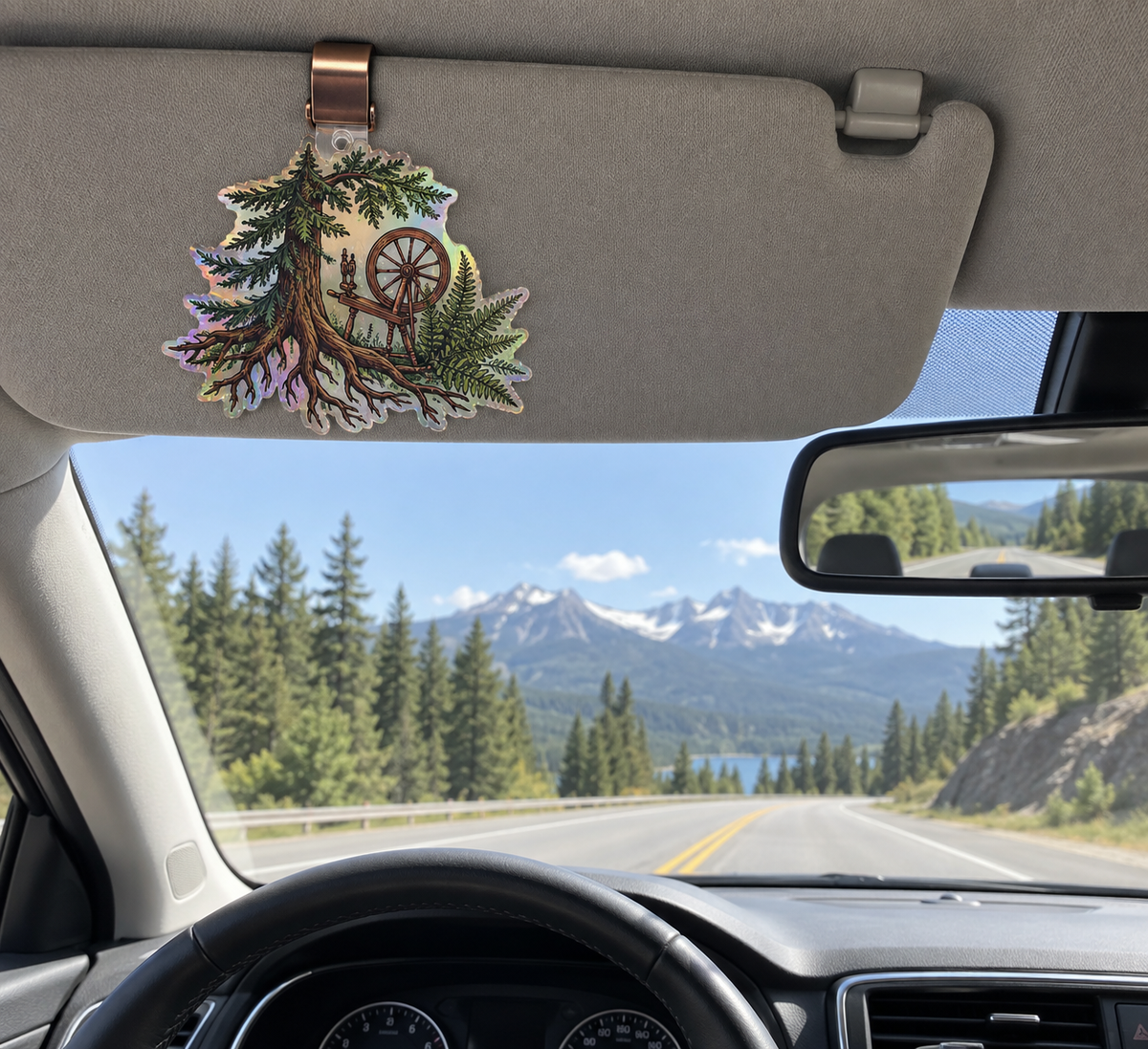 Rooted Maker Studio Holographic Car Visor Clip with printed optical 3D artwork in its use setting