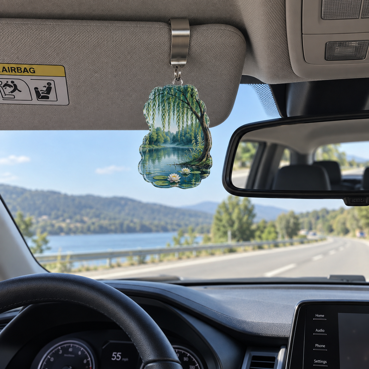 Willow Pond Reading Nook Holographic Car Visor Clip with printed optical 3D artwork in its use setting
