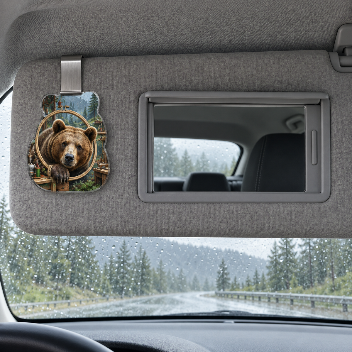 Rainloom Bear Atelier Holographic Car Visor Clip with printed optical 3D artwork in its use setting