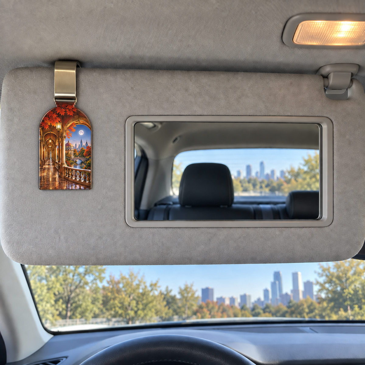 Copperleaf Gallery Passage Holographic Car Visor Clip with printed optical 3D artwork in its use setting