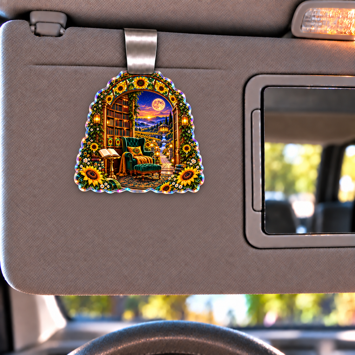Sunlit Story Alcove Holographic Car Visor Clip with printed optical 3D artwork in its use setting