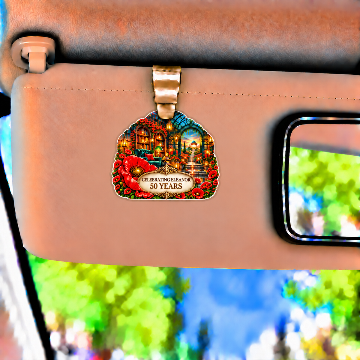 Poppy Birthday Curio Holographic Car Visor Clip with printed optical 3D artwork in its use setting