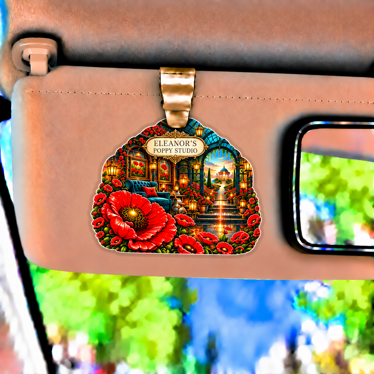 Poppy Atelier Signature Holographic Car Visor Clip with printed optical 3D artwork in its use setting
