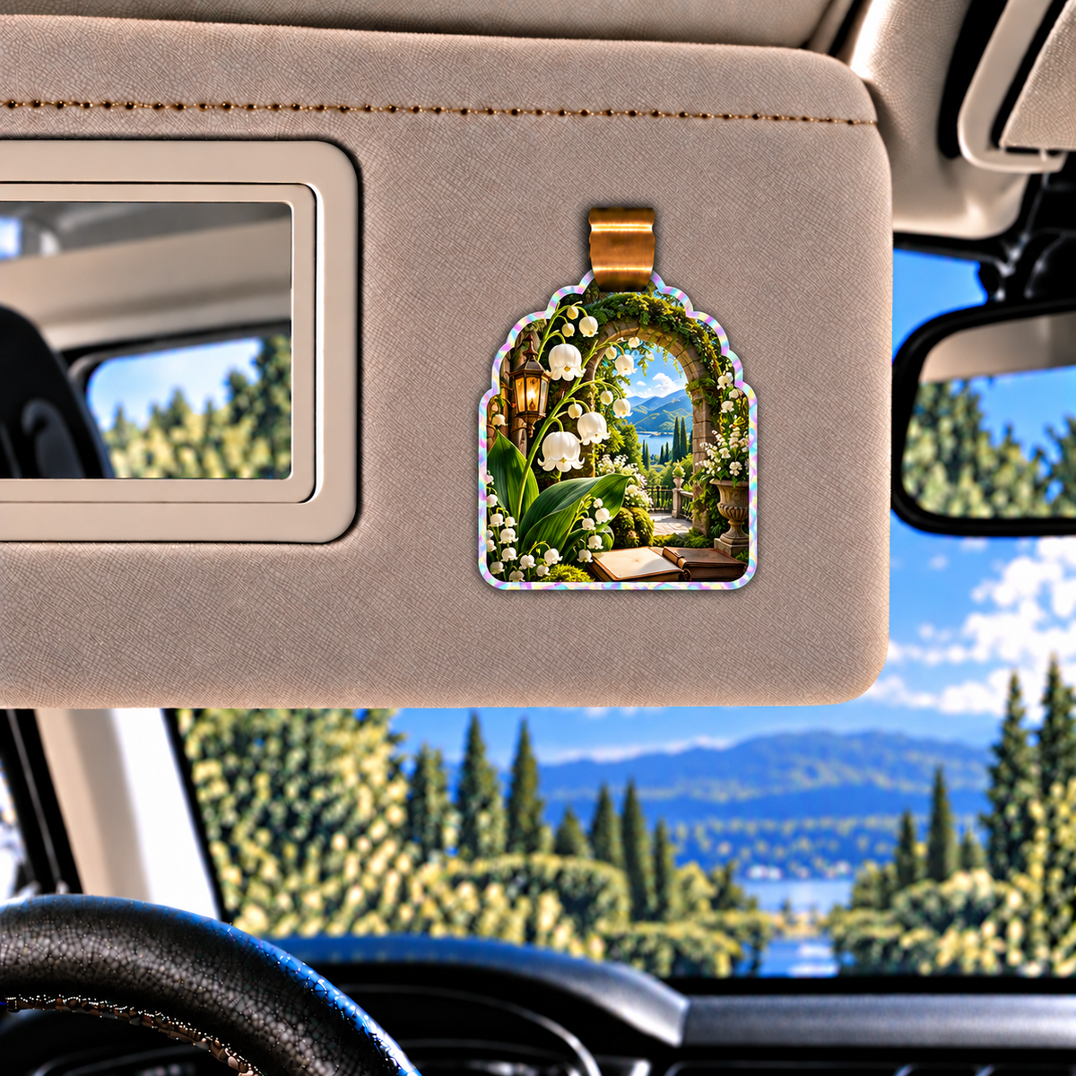 Lily Bell Reading Grotto Holographic Car Visor Clip with printed optical 3D artwork in its use setting