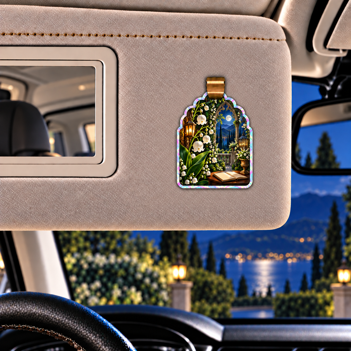Lily Moon Manor Holographic Car Visor Clip with printed optical 3D artwork in its use setting