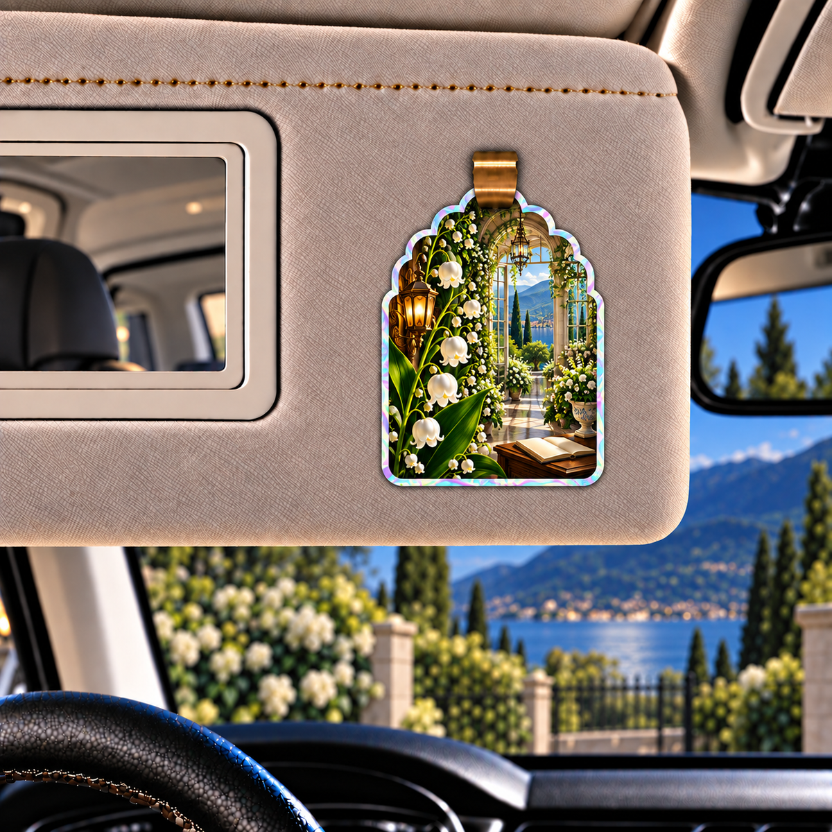Lily Bell Grand Salon Holographic Car Visor Clip with printed optical 3D artwork in its use setting
