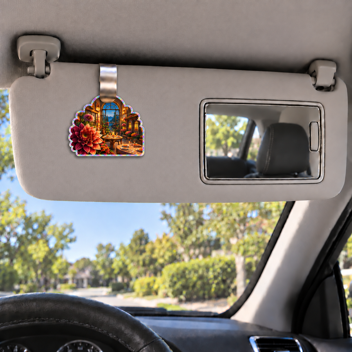 Dahlia Host Glow Holographic Car Visor Clip with printed optical 3D artwork in its use setting