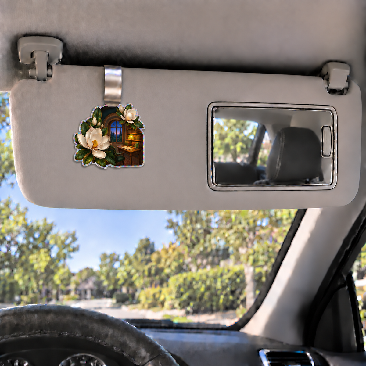 Magnolia Midnight Study Holographic Car Visor Clip with printed optical 3D artwork in its use setting