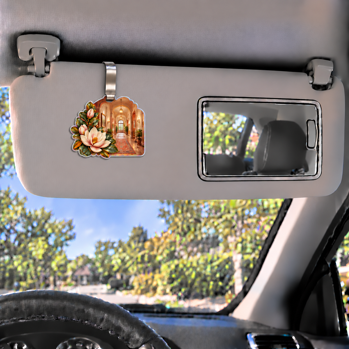 Magnolia Apartment Gallery Holographic Car Visor Clip with printed optical 3D artwork in its use setting