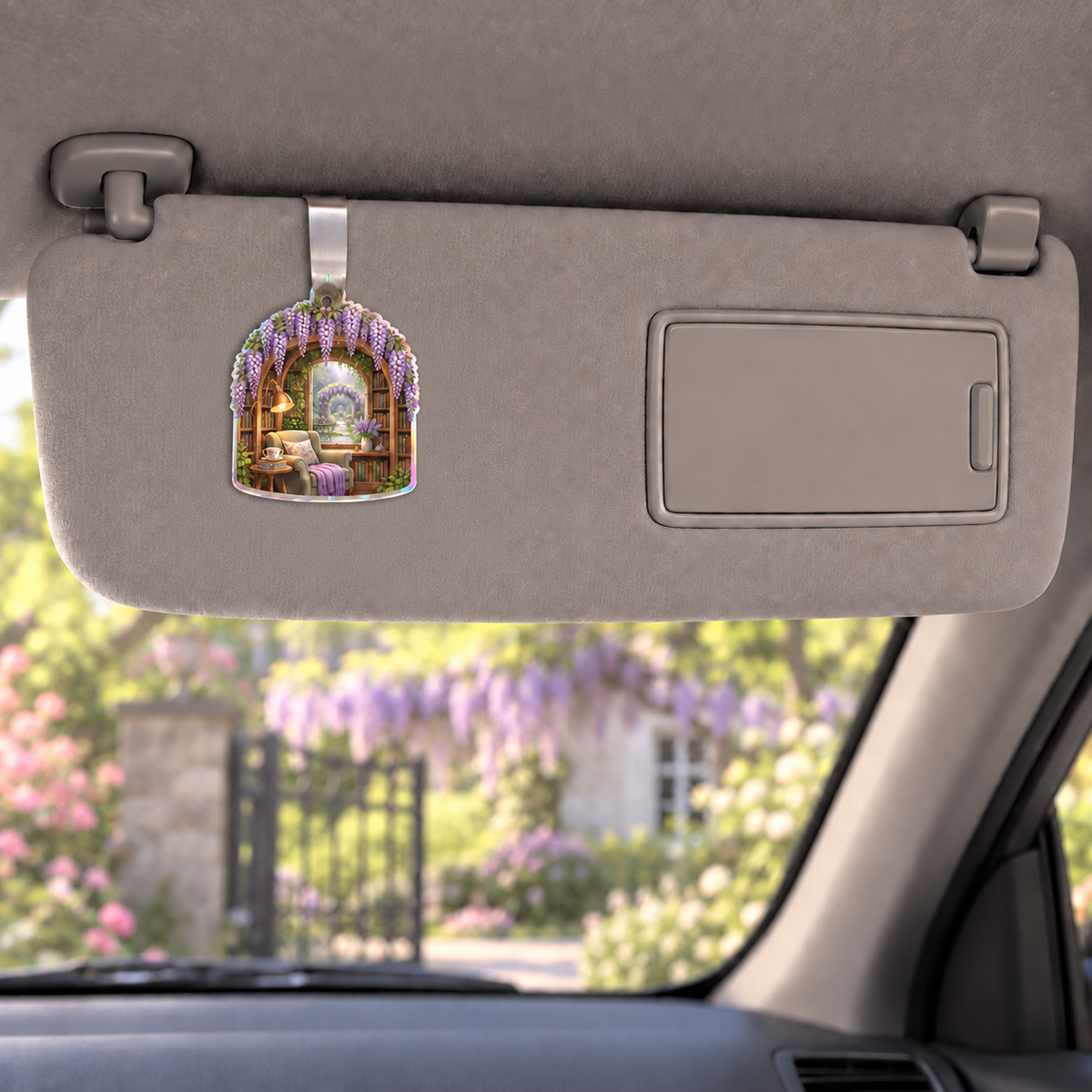 Wisteria Reading Nook Holographic Car Visor Clip with printed optical 3D artwork in its use setting