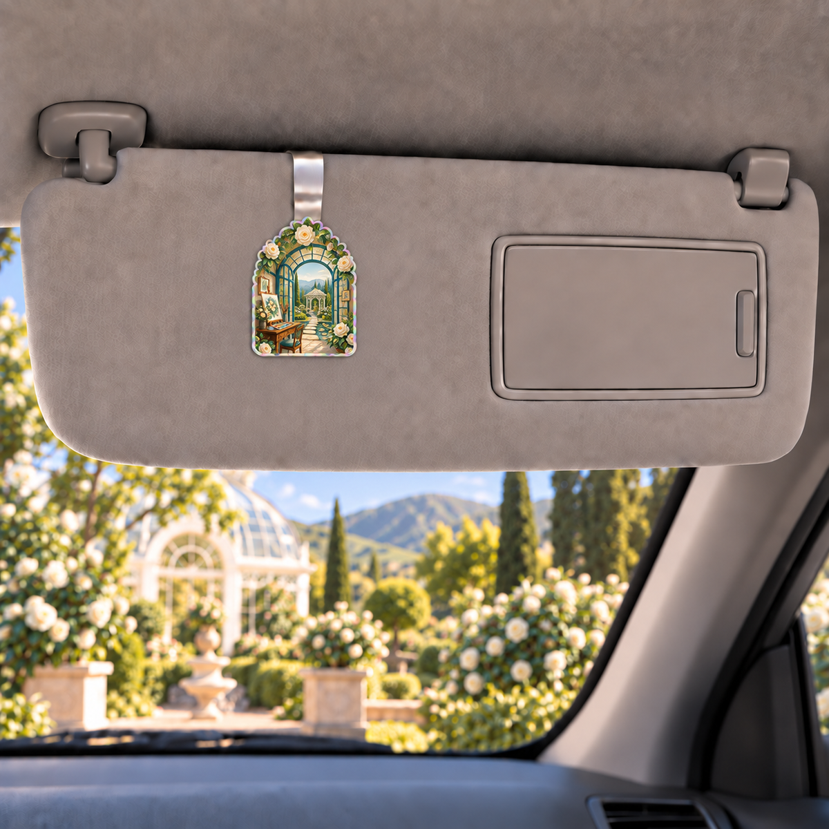 Camellia Atelier Holographic Car Visor Clip with flat printed optical 3D artwork in its use setting